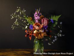 Beautiful full bouquet in vase in dark room bYLzj4