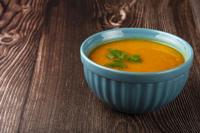 Delicious homemade pumpkin soup in bowl.