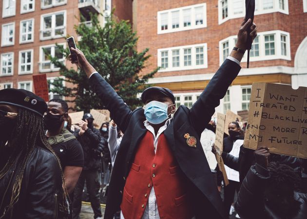 London, England, United Kingdom - June 6th, 2020: Man in blazer and face mask at protest