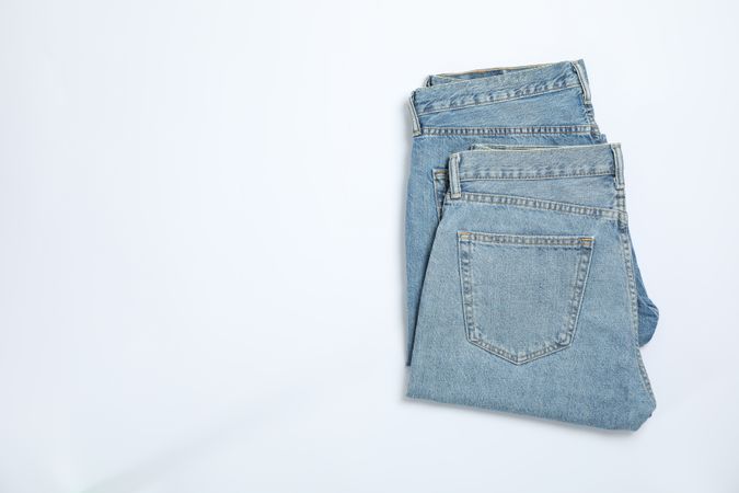 Jeans on light background, space for text