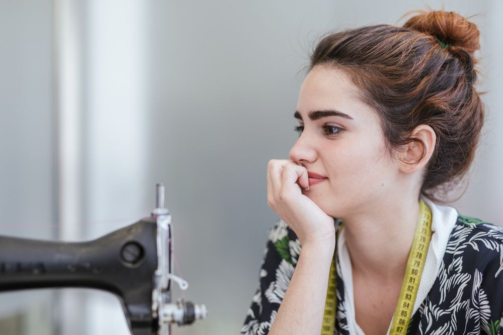Woman in a sewing school