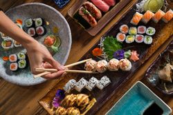 Unrecognizable person eating sushi
