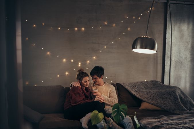 Romantic couple in cozy living room