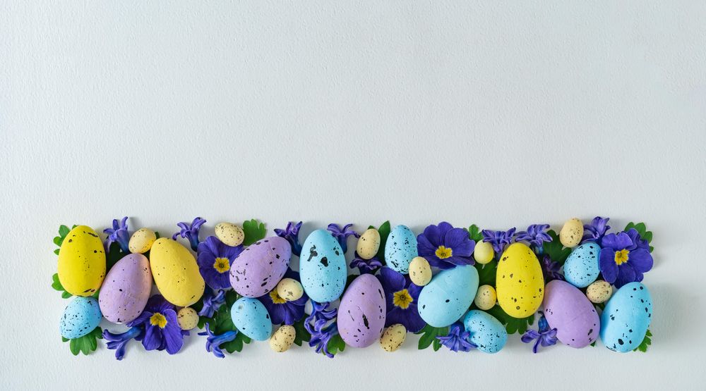 Easter eggs and purple flowers and leaves