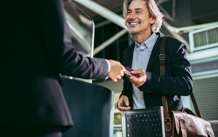 Businessman doing check in at airport