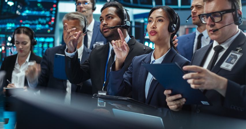 Team of Multiethnic Male and Female Traders Working in a Modern Stock Exchange Company.