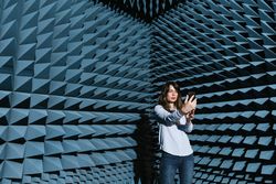 Woman in sound room taking selfie