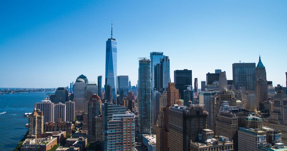 Scenic Aerial New York City View of Lower Manhattan Architecture. Panoramic Wall Street Financial District Photo from a Helicopter. Cityscape with Office Buildings and Skyscrapers
