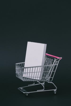 Shopping cart with rectangle box on dark background