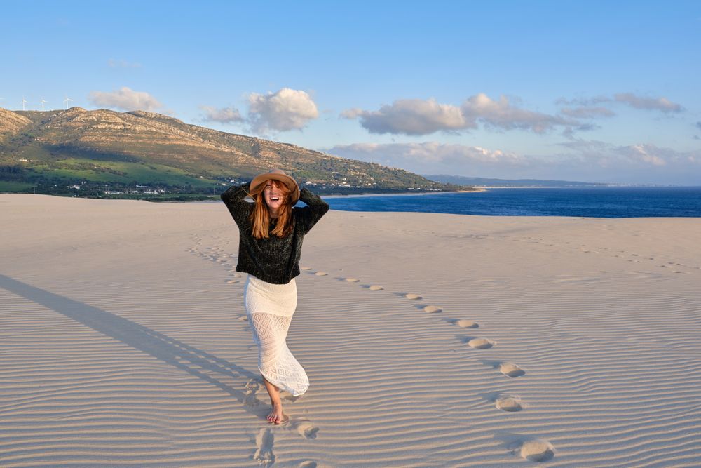 woman on desert nature during sunset