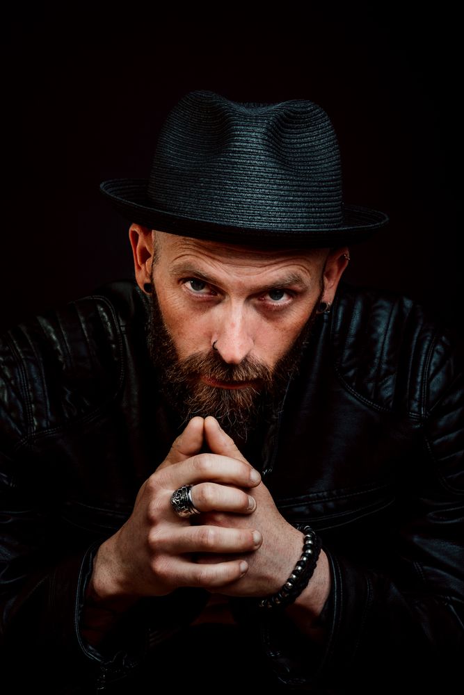 Young bearded guy in leather jacket