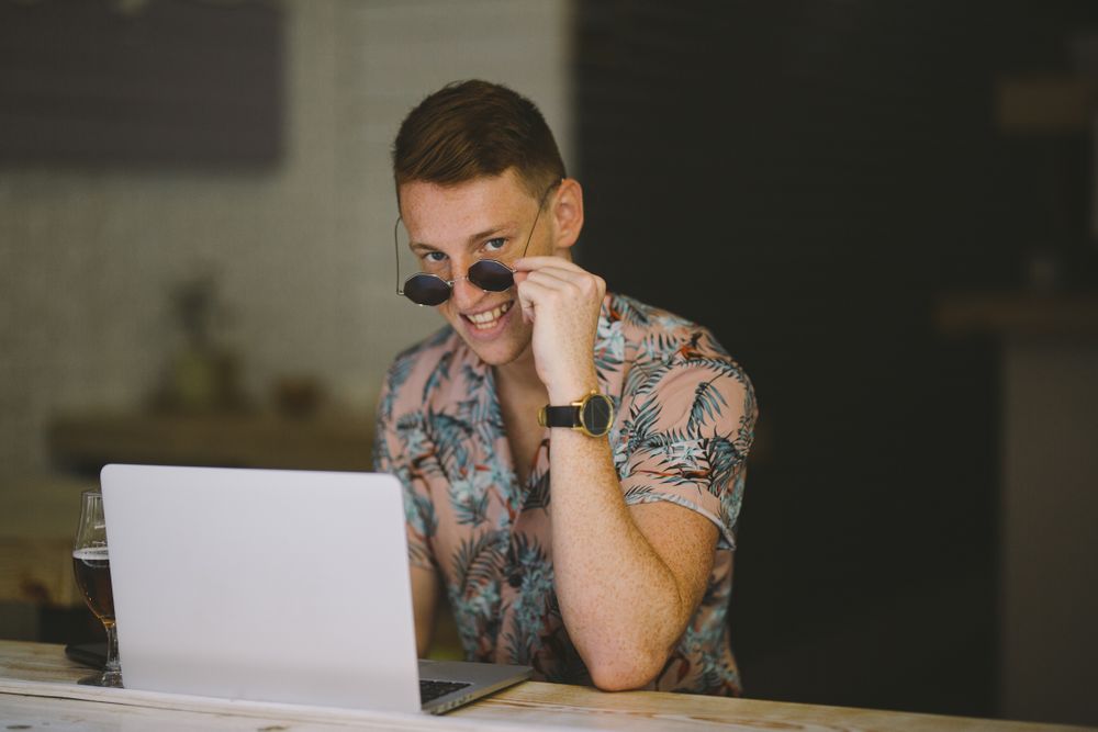 Man working on browsing laptop