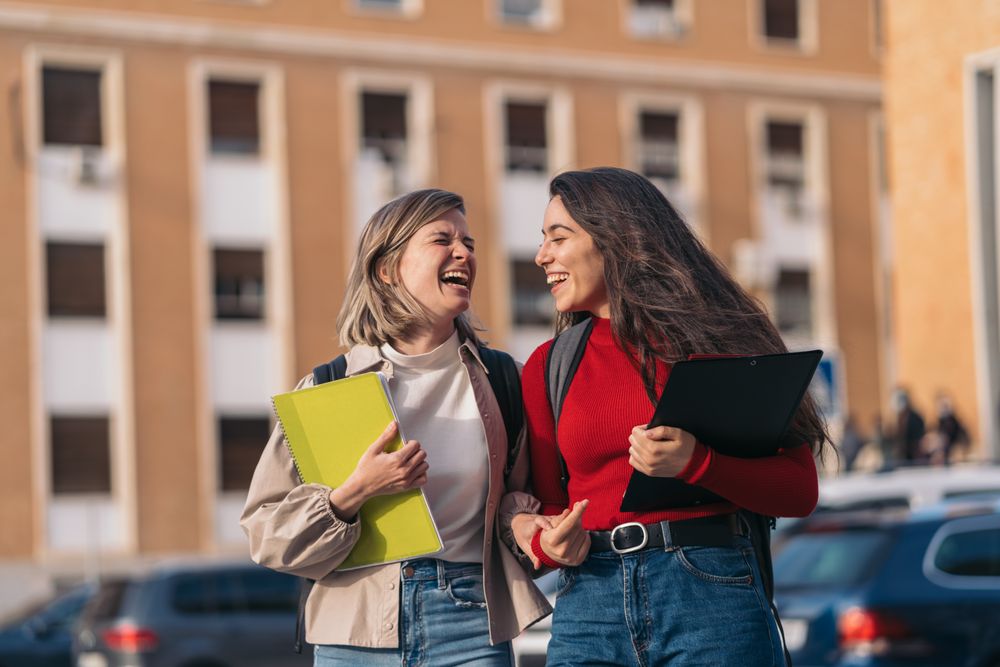 Two students laughing.