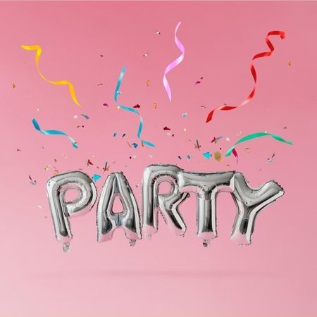 Silver party balloons with streamers and conferring on pink background