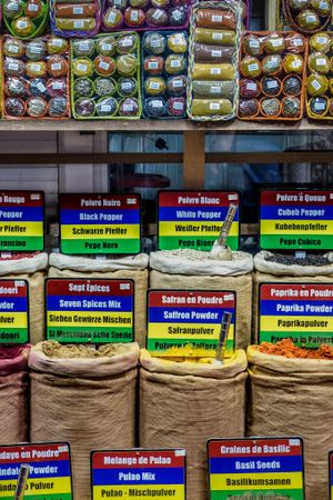 Large bags of spices labeled in different languages