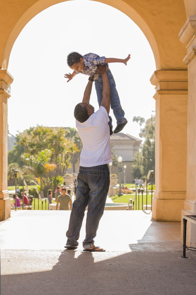 Father Lifting Son in the Park