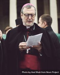 London, England, United Kingdom - March 5 2022: Catholic Bishop reading from paper outside 41wRD0
