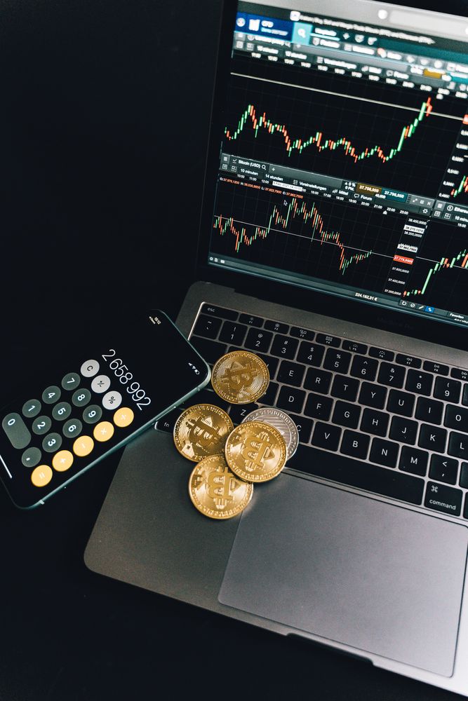 Top view of bitcoins on a laptop and smartphone