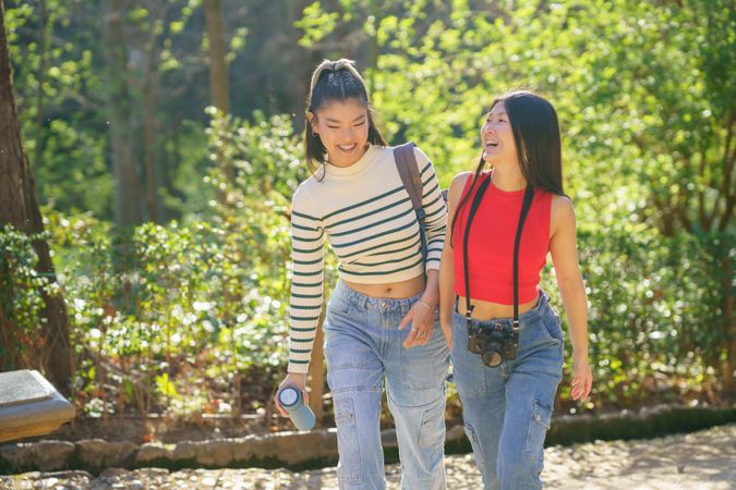 Chinese female friends walking outside