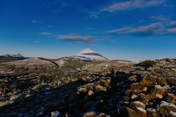 Clouds near snowy mountain