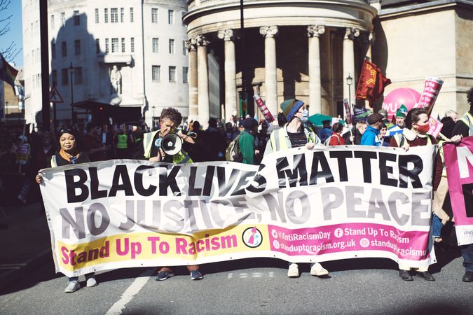 London, England, United Kingdom - March 19 2022: Large group protesting with banners in London