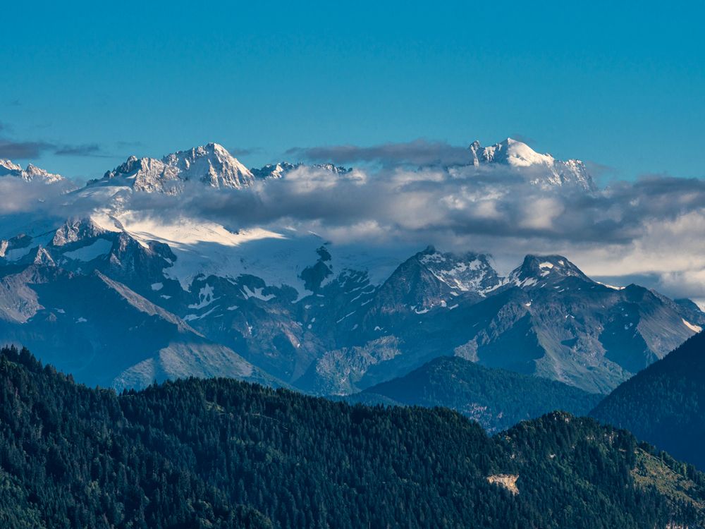 Summer travel to the Swiss Alps. Sun, warm beautiful weather, relaxation and travel.