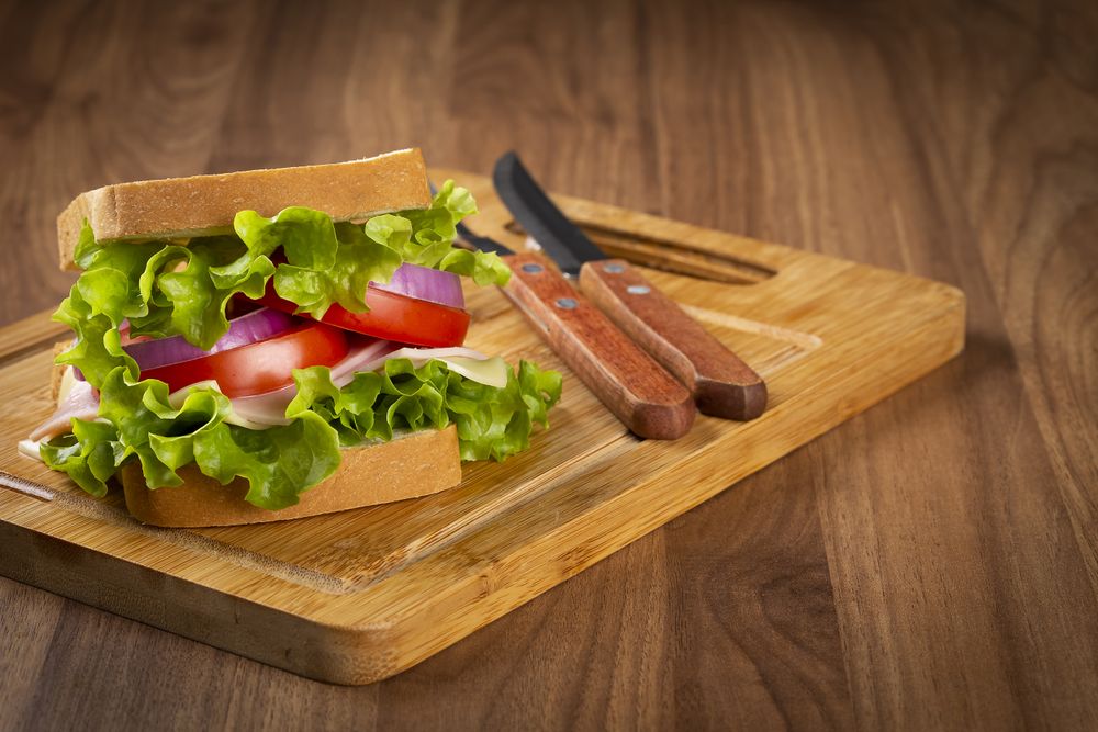 Natural sandwich. Sandwich with cheese, ham, lettuce, tomato and red onion.