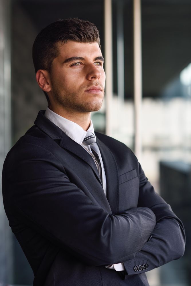 Portrait of man with blue eyes in suit and tie