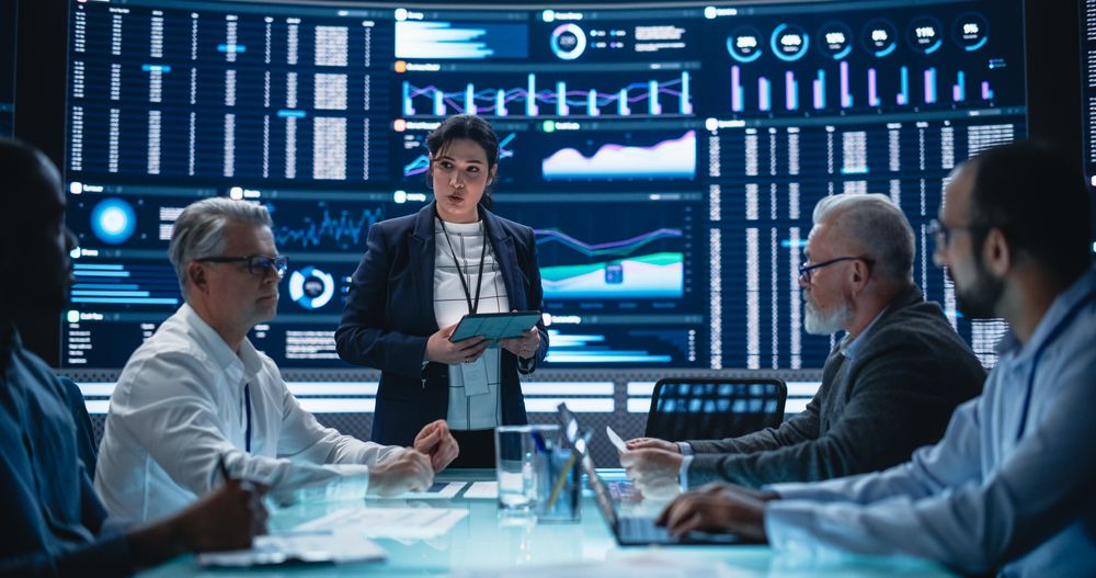 Multiethnic Chief Financial Officer Holding a Meeting with a Group of Fintech Investors.