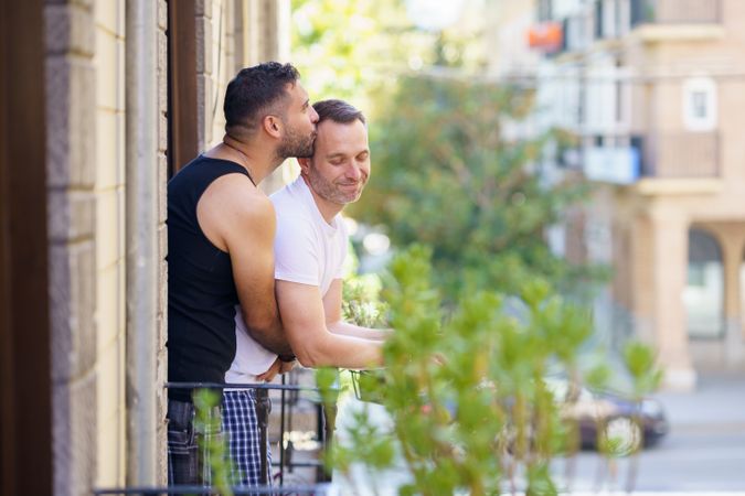 Two men being romantic on their patio together