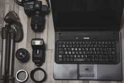 Photography equipment placed near laptop
