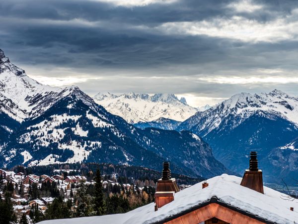 Swiss Alps winter landscape with snow and sun, mountains in Europe