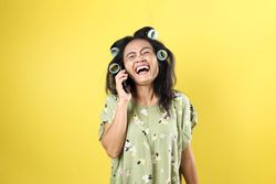 Indonesian Mom Laughing While Making a Call