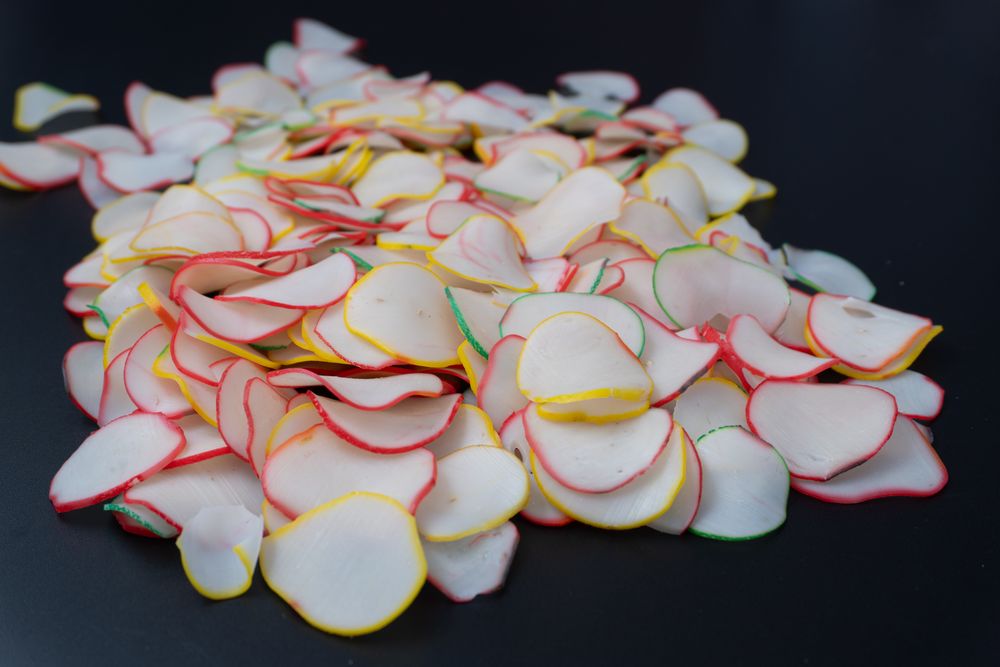 Thinly sliced, dried raw crackers ready to be fried