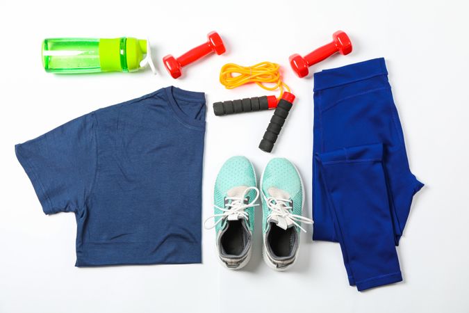 Healthy lifestyle accessories on blank background, top view