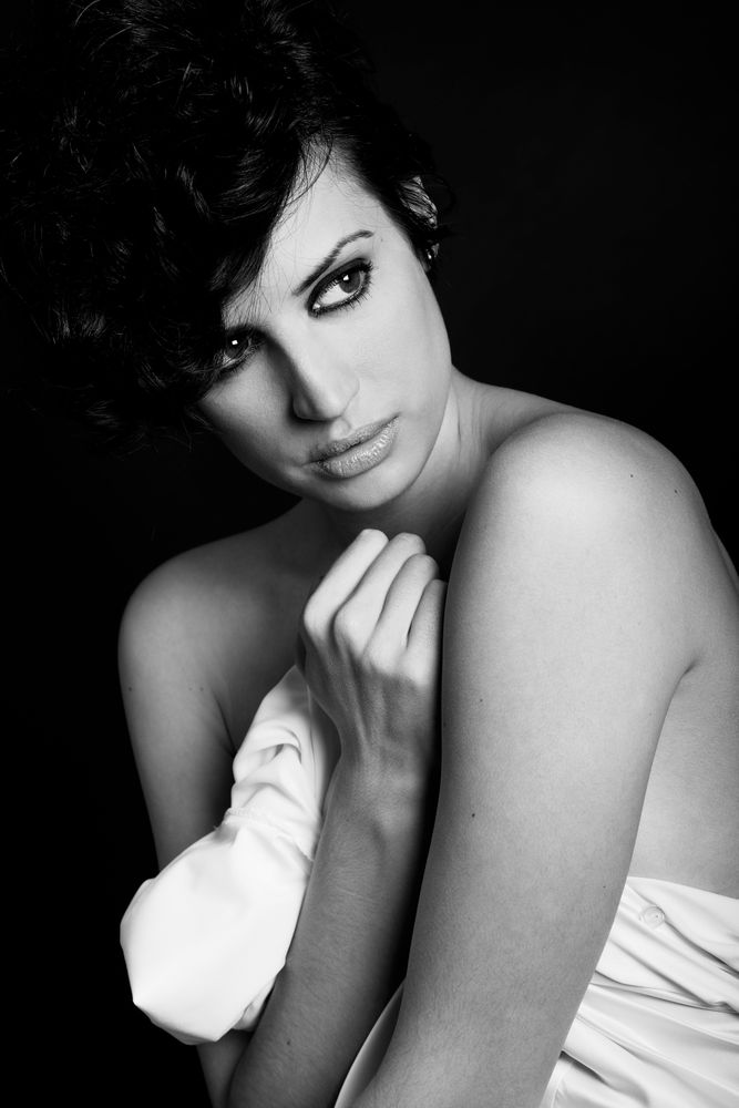 Woman wrapped in sheet in b&w shoot