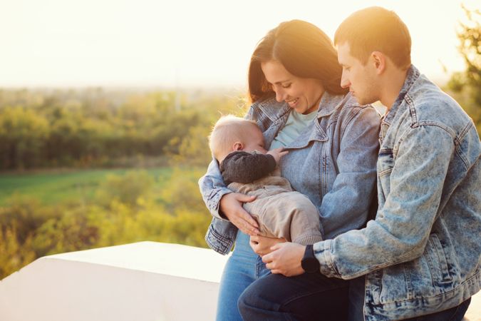 Mother breastfeeding baby outdoor
