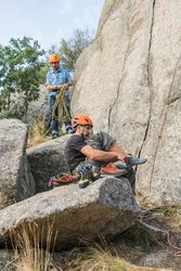 A rock climber is preparing to start climbing