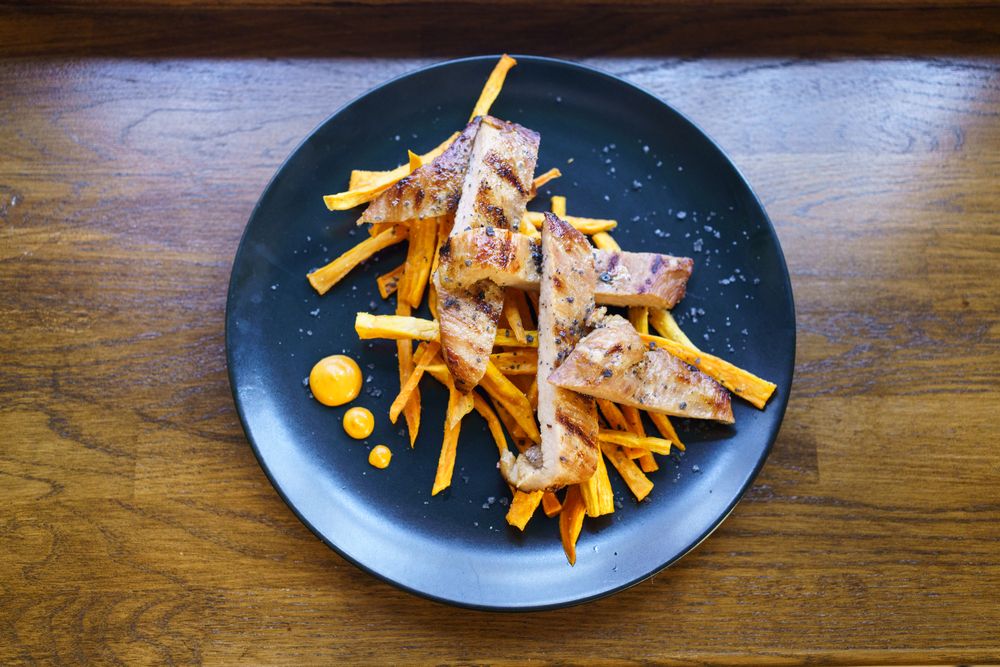 Top view of secreto iberico with potatoes