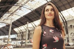 Woman standing at train station