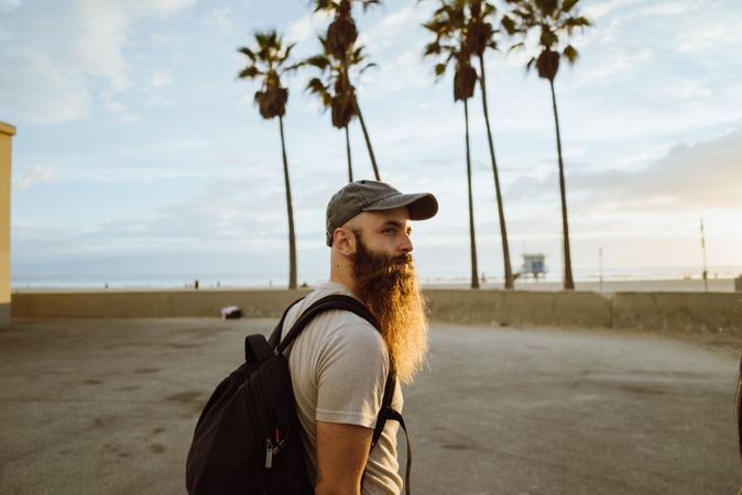 Bearded traveler near beach