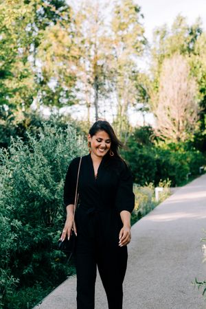 Cheerful female walking in park