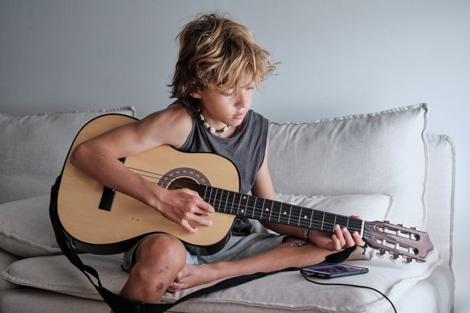 Child playing the guitar