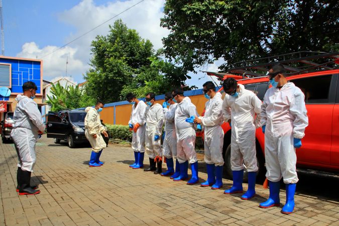 Group of healthcare workers in PPE standing outdoor