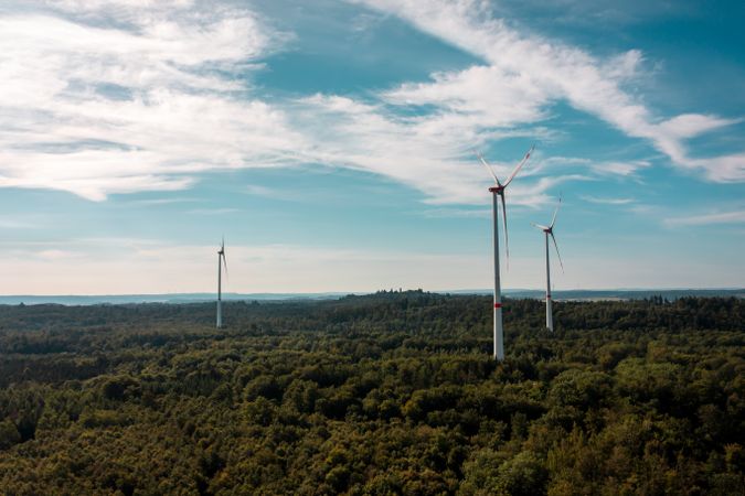 Aerial view shot with wind turbines in the middle of the forest, in Baden Wurttemberg region, Germany