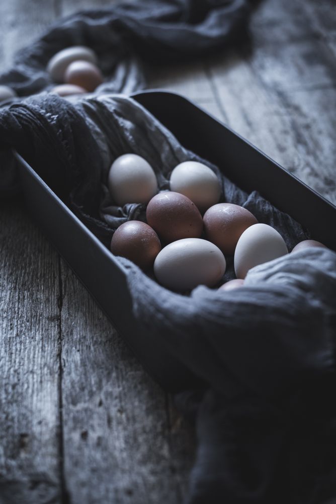 Raw eggs on tablecloth
