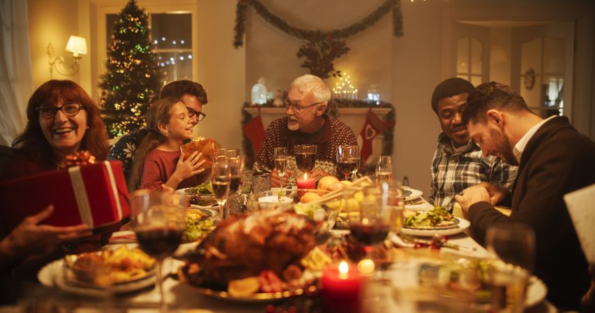 Big Diverse Family Exchanging Christmas Gifts to Celebrate the Holiday.