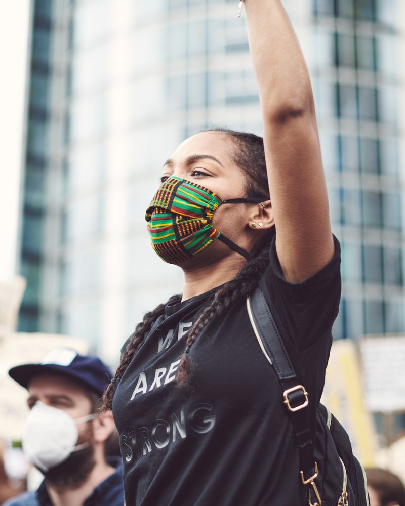 London, England, United Kingdom - June 6th, 2020: Woman with African patterned face mask