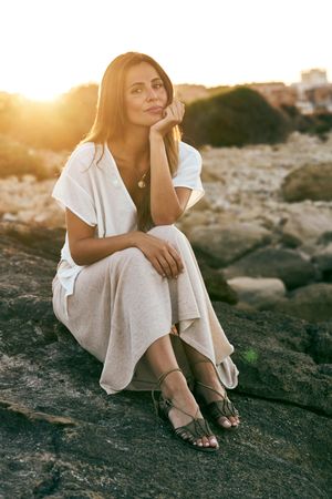 young woman posing on rock
