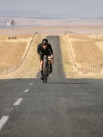 Professional cyclist practising on a empty road
